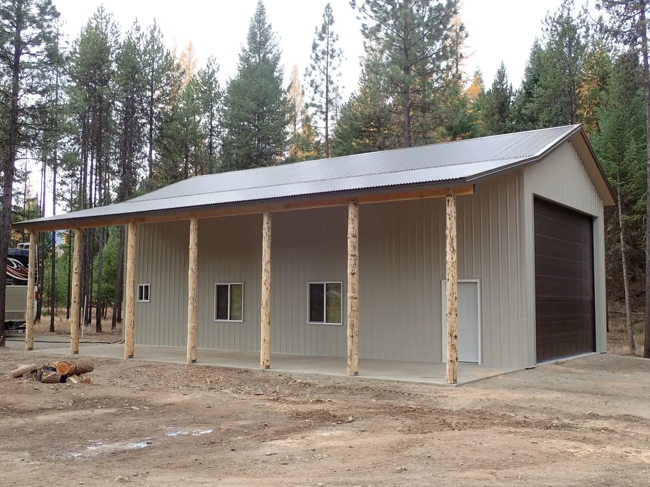 A large building with a porch and a garage door